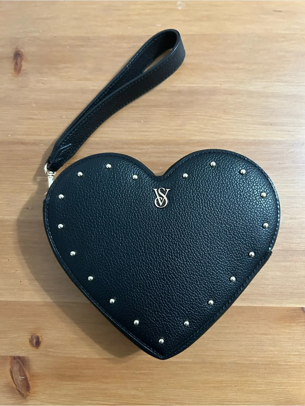 Victoria’s Secret heart clutch with removable strap in black and gold studs